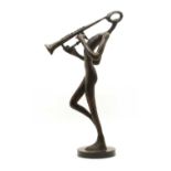 A modern bronze musician figure on circular base,