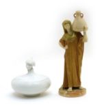 A Royal Worcester blush ivory figure of a female watercarrier,