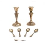 A pair of silver candlesticks with knopped tapering stem,