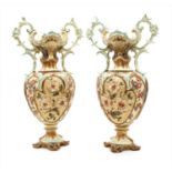 A pair of continental majolica twin handled vases,