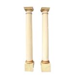 A pair of painted faux marble Ionic columns,