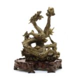 A Japanese brass model of an entwined dragon,