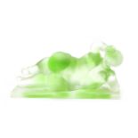 A uranium style glass model of a reclining nude female