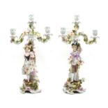 A pair of Sitzendorf floral encrusted four light table candelabra,