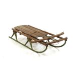 A cast iron and wooden 'Flexible Flyer' sledge,