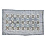 A Scandinavian flat-weave rug,