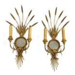 A pair of twin-branch wall lights,