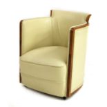 An Art Deco walnut and cream leather lounge chair,