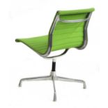 A lime green desk chair designed by Charles Eames,