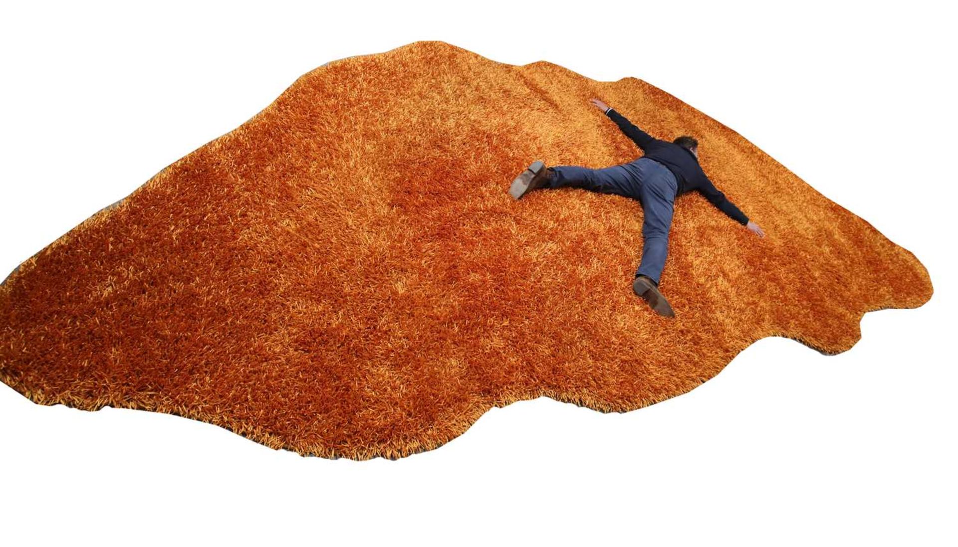 An Alton-Brooke ginger thick shag pile rug,