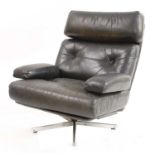 A Tetrad 'Nucleus' black leather revolving lounge chair,