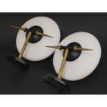 A pair of brass wall lights,