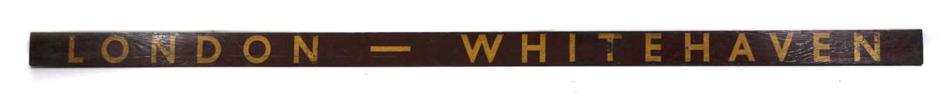 A 'London - Whitehaven' station sign,