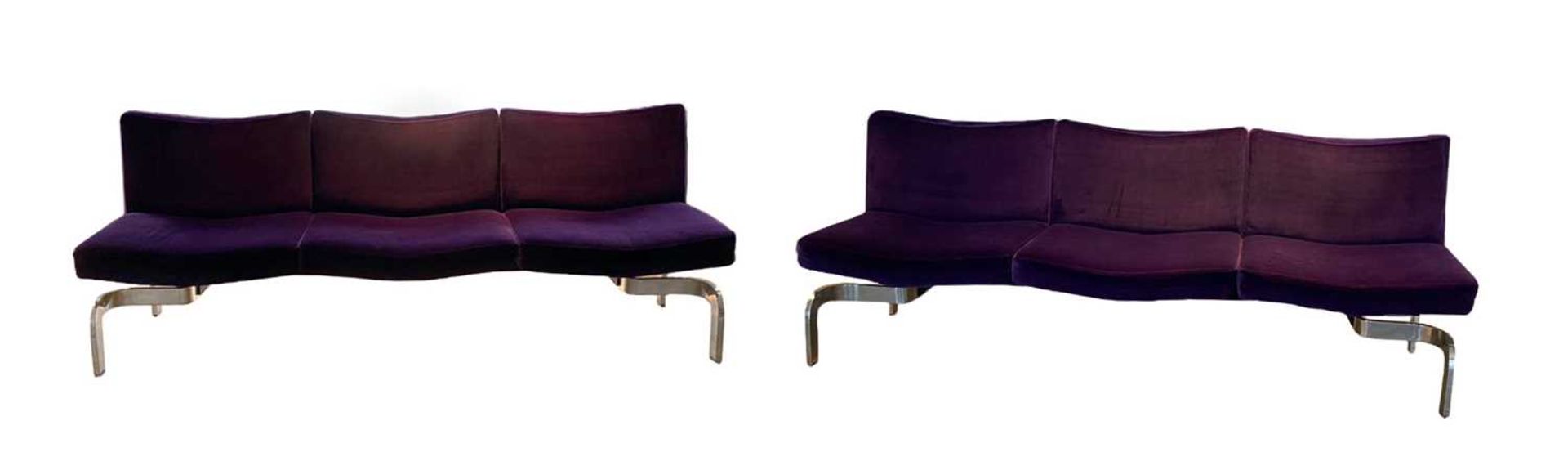 A pair of purple upholstered settees,