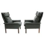 A pair of Danish black leather armchairs,