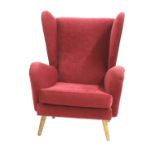 An Howard Keith wingback armchair,