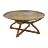 A brass top table,