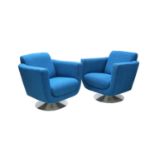 A pair of modern lounge chairs,