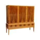 A Danish walnut and maple cabinet,