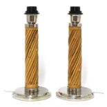 A pair of cane table lamps,