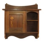 A mahogany hanging wall cabinet,