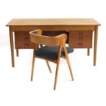 A Danish teak and oak desk,