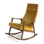 A teak rocking chair,