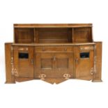 An Arts and Crafts oak cabinet,