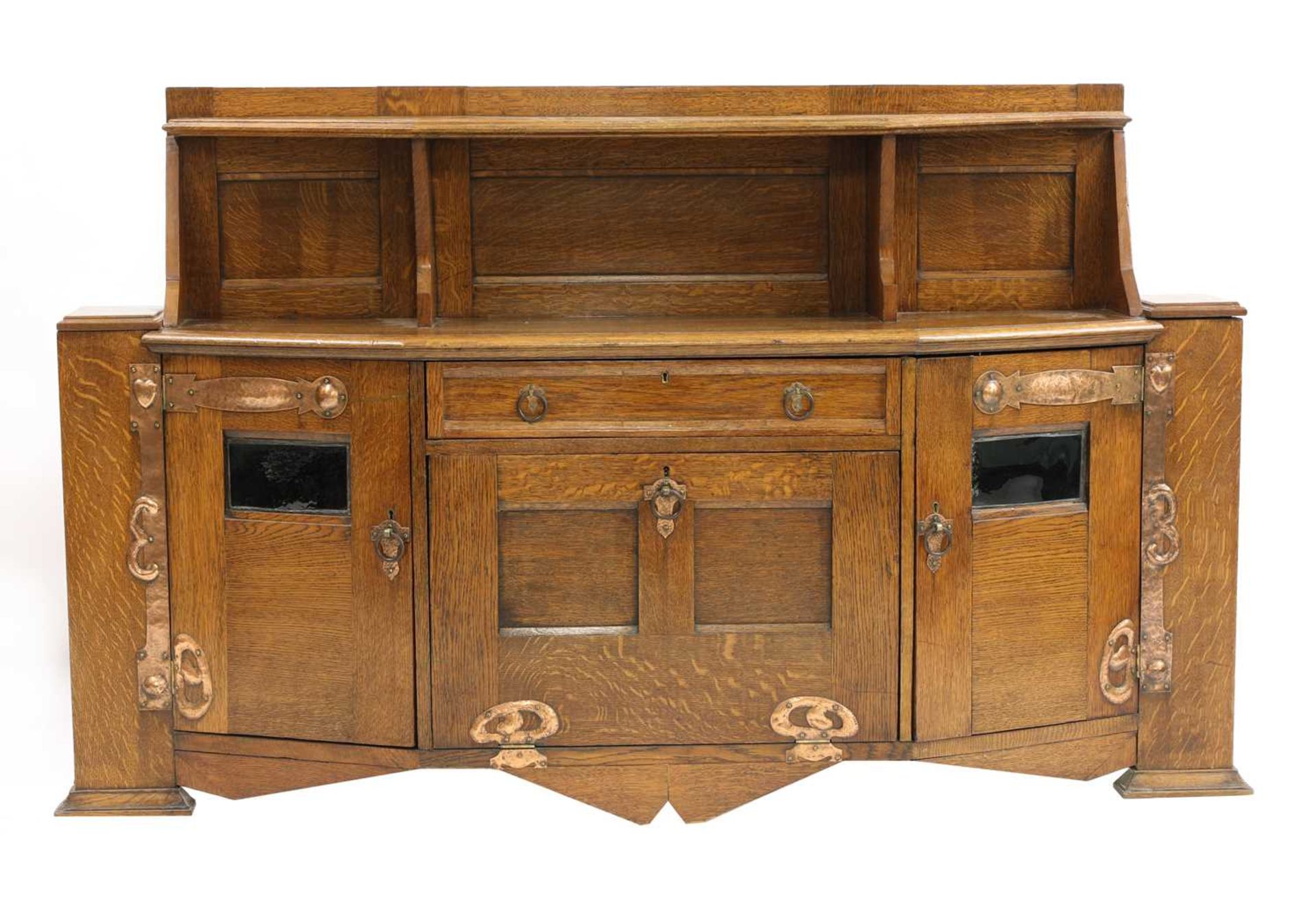 An Arts and Crafts oak cabinet,