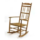An ash spindle back rocking chair,
