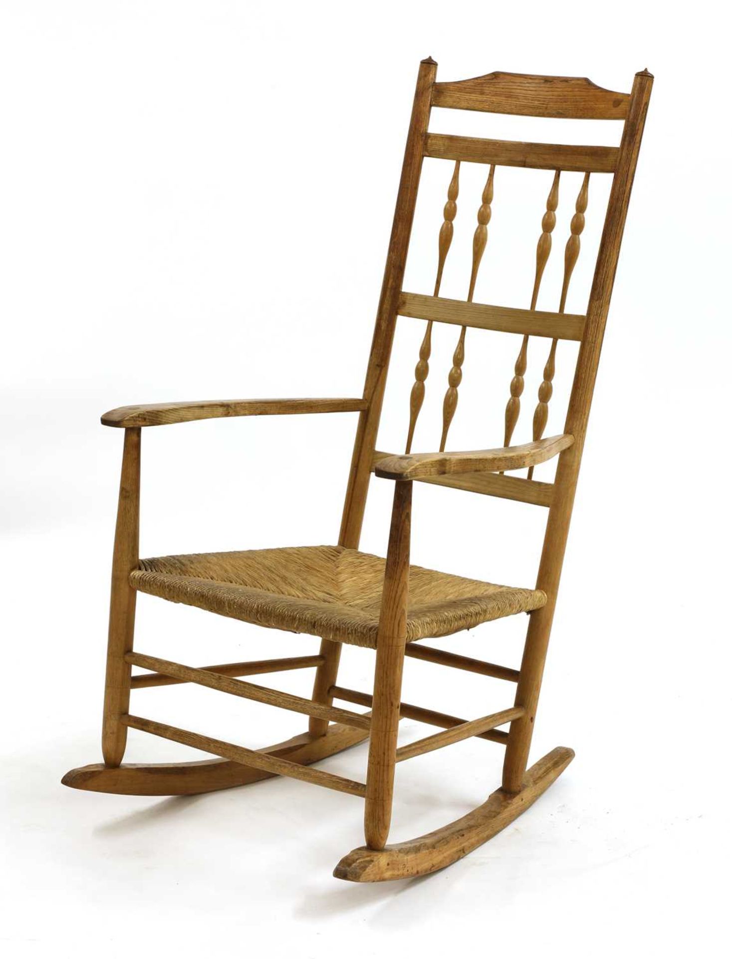 An ash spindle back rocking chair,