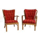 A near pair of Fritz Hansen lounge chairs,