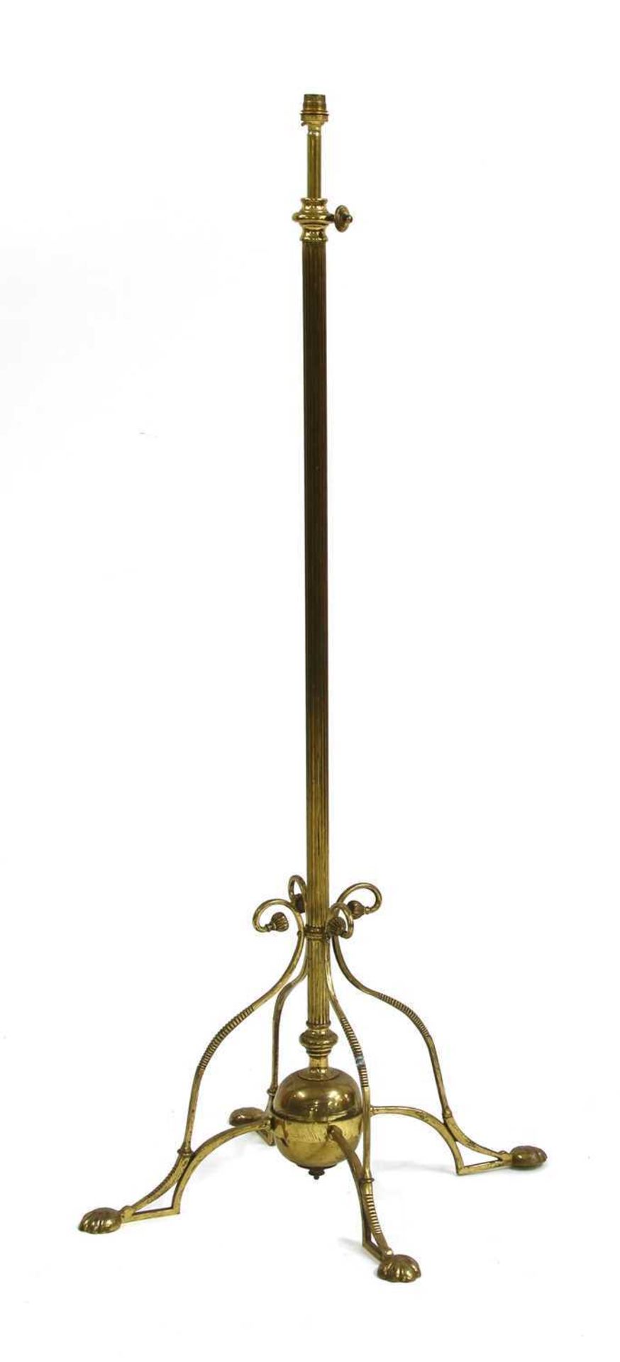 An Arts and Crafts brass standard lamp,