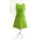 A lime green shift dress,