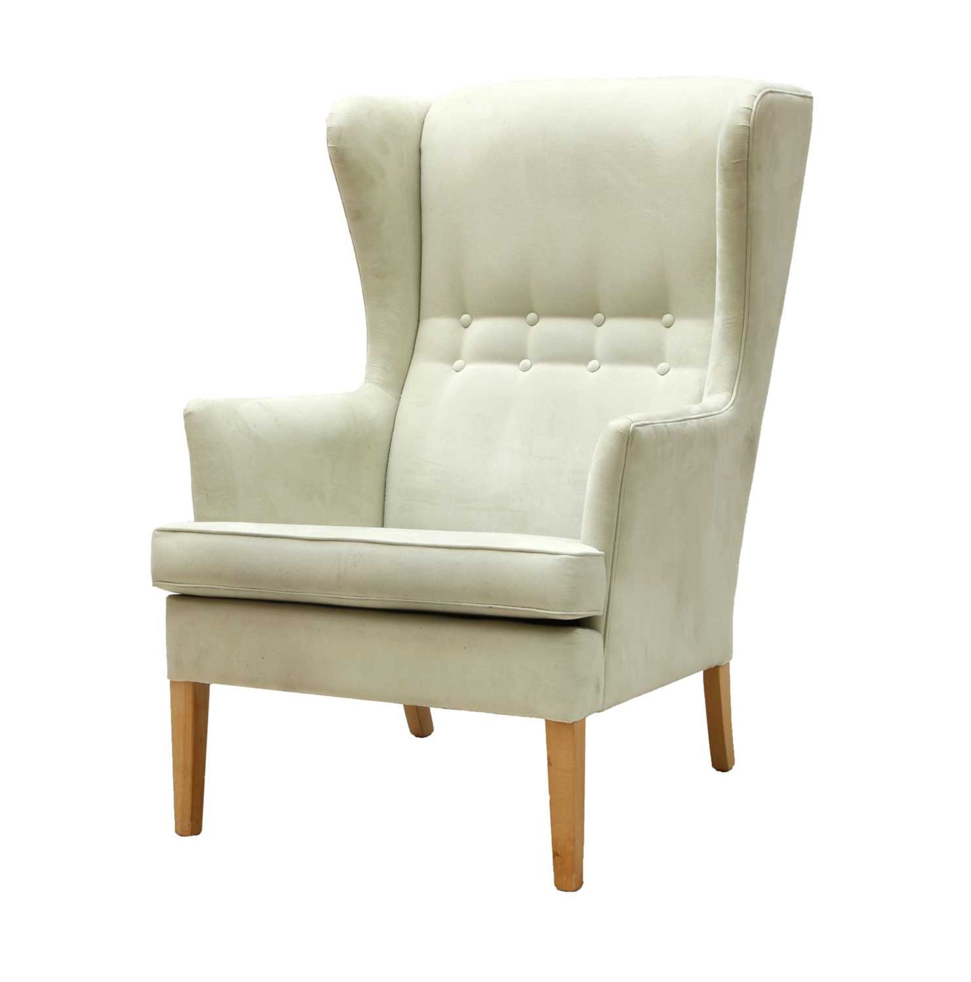 A Danish cream suede wingback armchair,