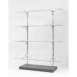 A pair of chrome and glass shelves,