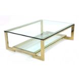 A gold-plated and glass coffee table,