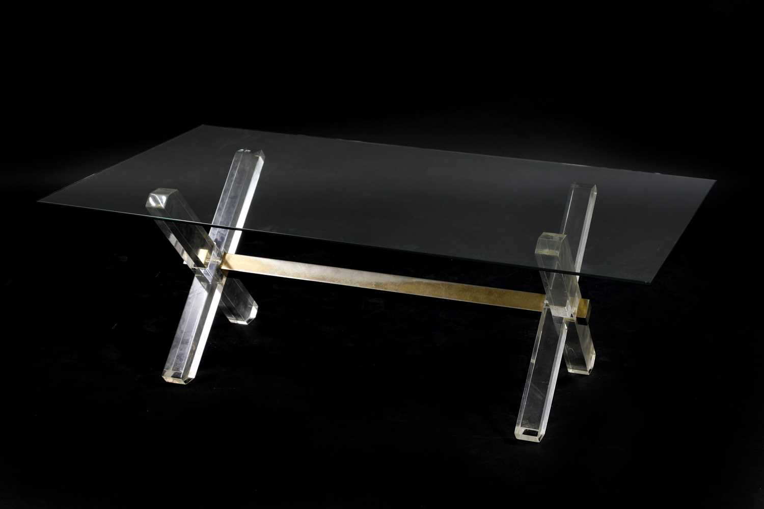 A Lucite and glass coffee table,