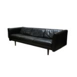 A large Danish black leather three-seater settee/daybed,