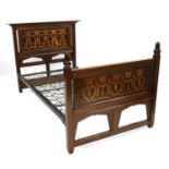 A mahogany inlaid bed,