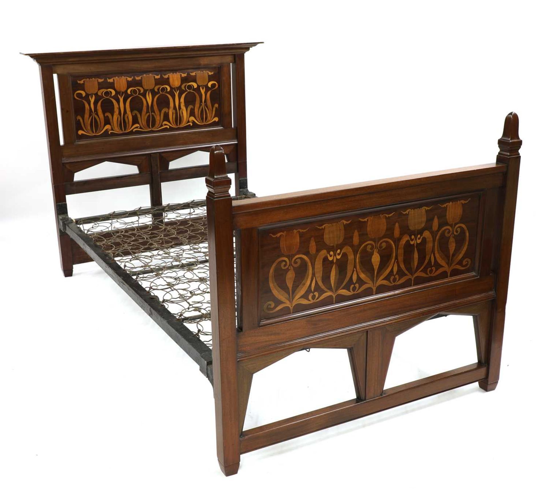 A mahogany inlaid bed,