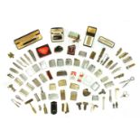 A collection of lighters and pocket combination tampers/knives,