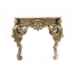 A carved and gilt marble topped console table