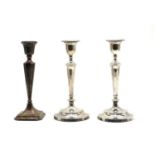 A pair of silver candlesticks,