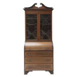 A Sheraton Revival mahogany cylinder bureau bookcase,
