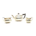 A silver three piece tea service,