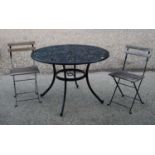 A black painted aluminimum garden table and two folding teak garden chairs