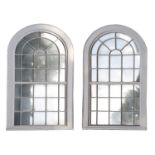 A pair of large window mirrors,