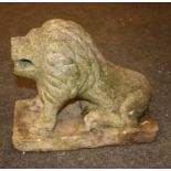 A carved stone figure of a lion,