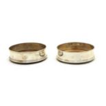 A matched pair of sterling silver wine coasters,